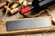 Rustic wooden board, wine and corks Rustic wooden board, wine and corks