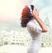 Beautiful woman listening music with headphones