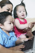 Mother with children and laptop