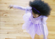 High angle view of a young girl dancing in ballet outfit