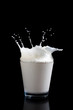 Milk splashing into glass