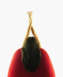 Woman sitting in chair with arms above head