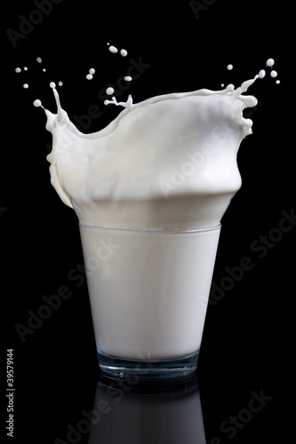 Photo: Milk splashing into glass Milk splashing into glass