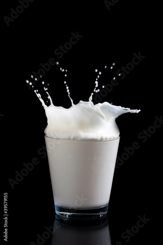 Photo: Milk splashing into glass Milk splashing into glass