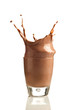 Chocolate splashing into glass
