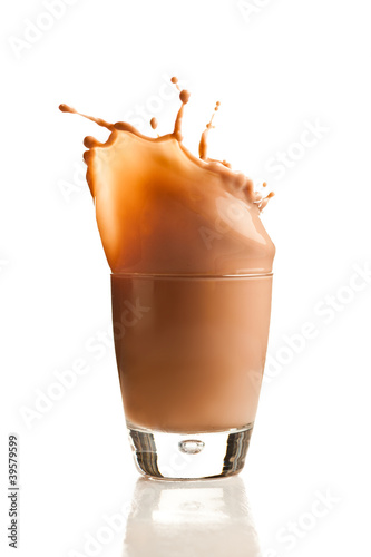 Photo: Chocolate splashing into glass Chocolate splashing into glass