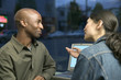 Couple with laptop talking