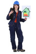 craftswoman holding an energy consumption label