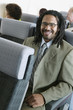 Portrait of businessman on airplane