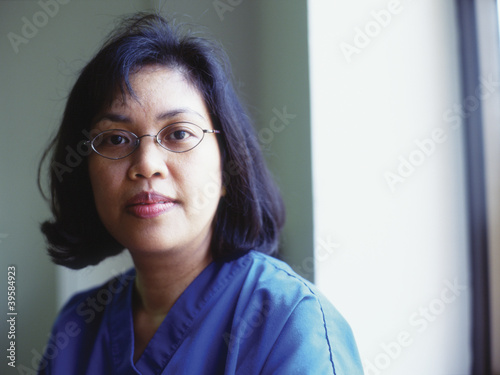 Photo: Portrait of a female nurse smiling Portrait of a female nurse smiling
