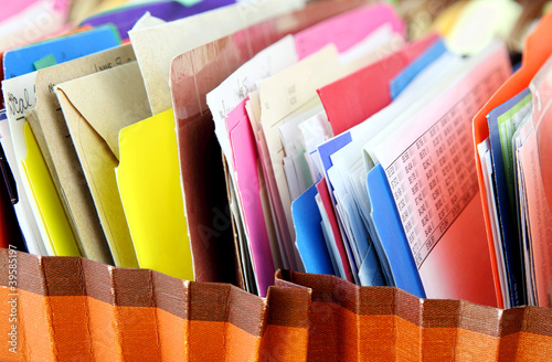 Photo: Row of folders in expending file pockets Row of folders in expending file pockets