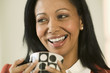 Businesswoman laughing and drinking coffee