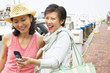 Two women with cell phone