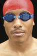 Close up portrait of man wearing goggles and swimming cap