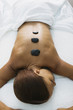 Woman receiving stone massage