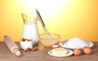 Ingredients for the dough wooden table on yellow background Ingredients for the dough wooden table on yellow background