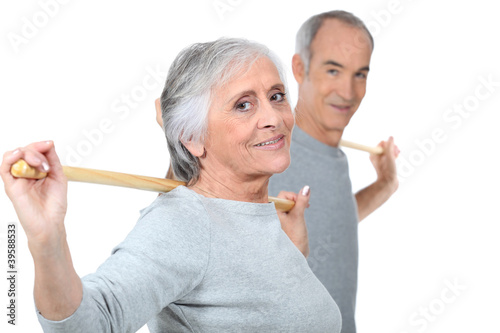 Photo: Mature couple exercising. Mature couple exercising.