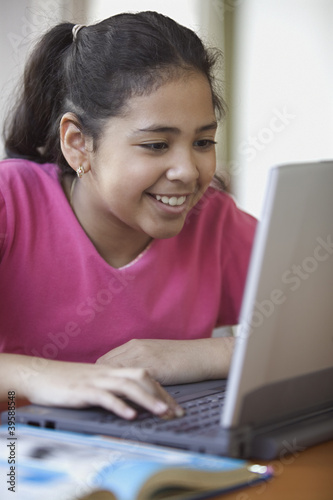 Photo: Girl working on computer Girl working on computer