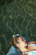 Woman floating on air mattress