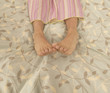 Woman's feet in bed