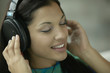 Young woman listening to headphones