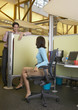 Business people talking over cubicle wall