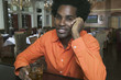 Portrait of young man having a drink