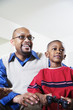 Father and son playing video game
