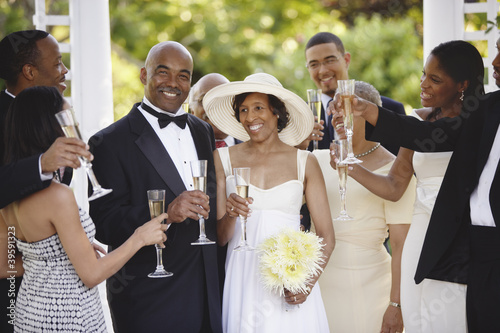 Photo: Wedding guests toasting bride and groom Wedding guests toasting bride and groom