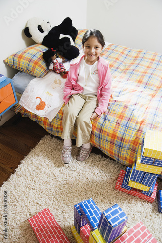 Photo: Girl sitting on bed Girl sitting on bed