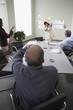 Businesspeople throwing paper balls