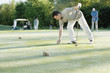 Picking up ball on putting green
