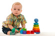 Serious baby boy with toys