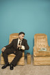 Businessman in chair waiting for phone to ring