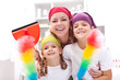 Cleaning taskforce - woman with kids tidy up