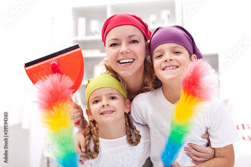 Photo: Cleaning taskforce - woman with kids tidy up Cleaning taskforce - woman with kids tidy up