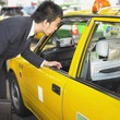 Businessman talking to cab driver