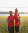 Portrait of two soccer players back to back