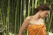 Portrait of woman with hair blowing in forest