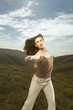 Portrait of woman reaching out