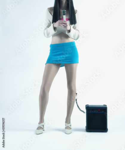 Photo: Young woman singing karaoke Young woman singing karaoke