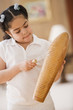 Young girl playing percussion instrument