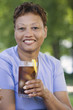 Middle-aged woman drinking a soda