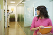 Businesswoman holding folders
