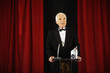 Senior man accepting an award