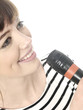 Photo: Young Woman Singing with Microphone. Model Released Young Woman Singing with Microphone. Model Released