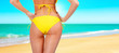 Closeup of a female backside in a yellow swimsuit Closeup of a female backside in a yellow swimsuit