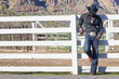 Young man in cowboy outfit posing for the camera