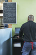Rear view of man working in restaurant