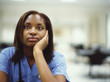 Female doctor leaning on her hand